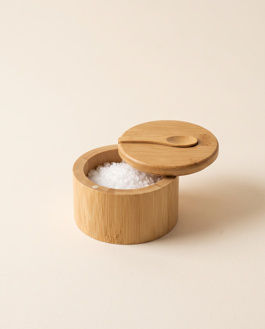 Bamboo salt box with swivel lid and spoon, filled with sea salt